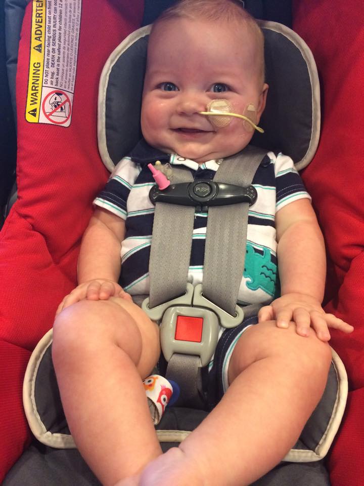 Baby boy in car seat going to school 7 weeks after coming home from the hospital. 