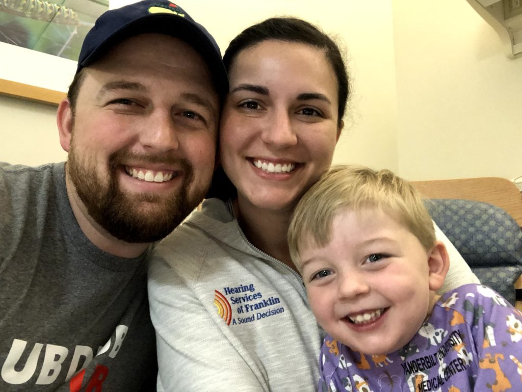 Family waiting in surgery holding before toddler son's Fontan heart surgery