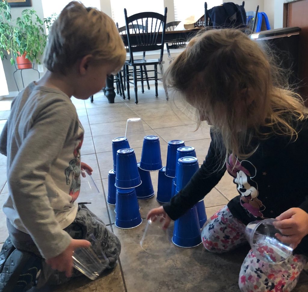 Cup stacking indoor toddler activities.